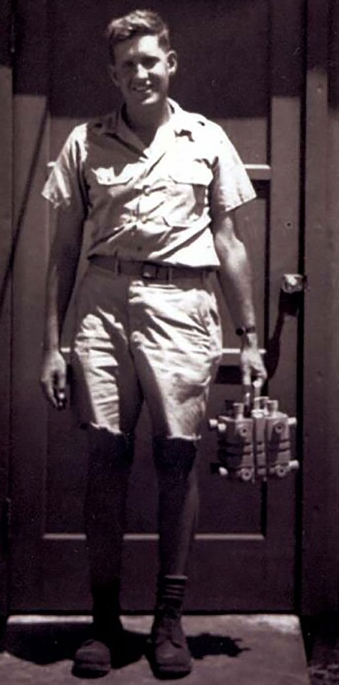 Man in military uniform holding a device; linked to terrifying backstories.