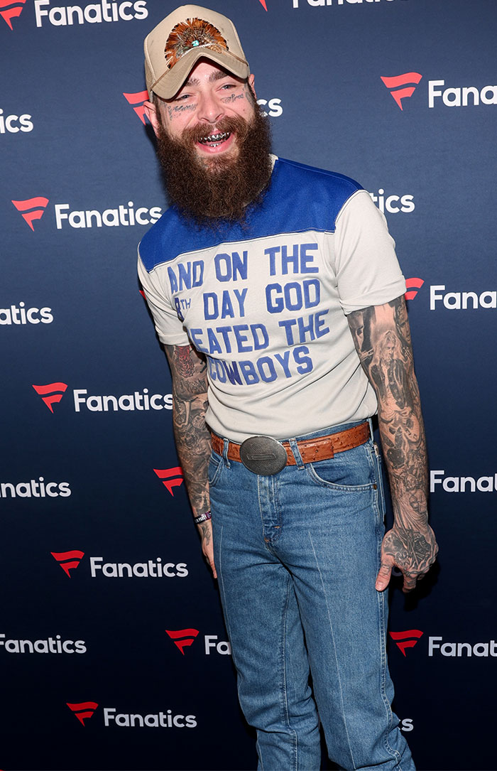 Man in a cap and printed shirt with tattoos at Super Bowl 2025 event.