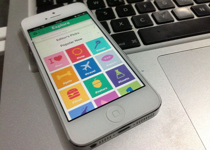 Smartphone displaying an app with colorful icons, placed on a laptop keyboard; represents products that failed despite potential.