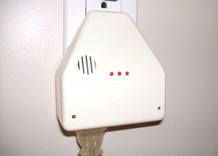 Electronic device plugged into a wall outlet, representing products that failed.