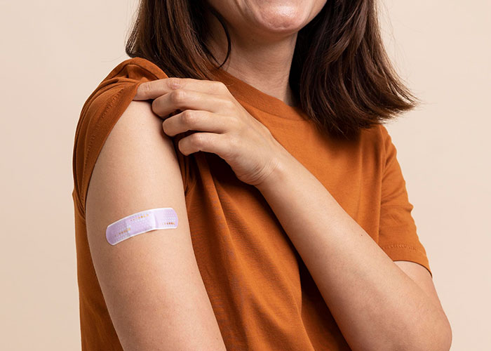 Person wearing a bandage on their arm and an orange shirt, illustrating products that failed despite being good.