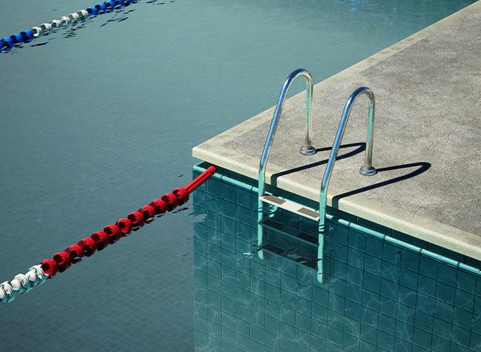 Swimming pool edge with metal ladder, highlighting quitting a job for peace and leisure.