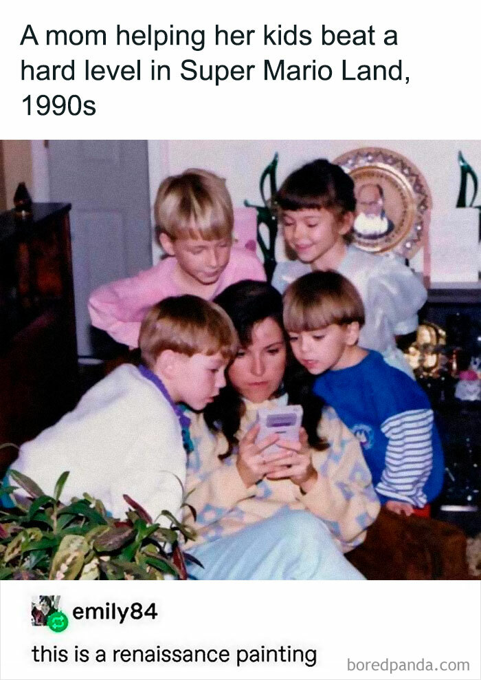Mom with kids playing Super Mario in the 1990s; group focused on a Game Boy. Hilarious nostalgic scene.