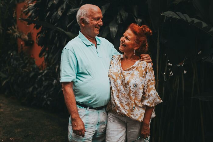 Elderly couple embracing and smiling, symbolizing a respectful relationship after decades.