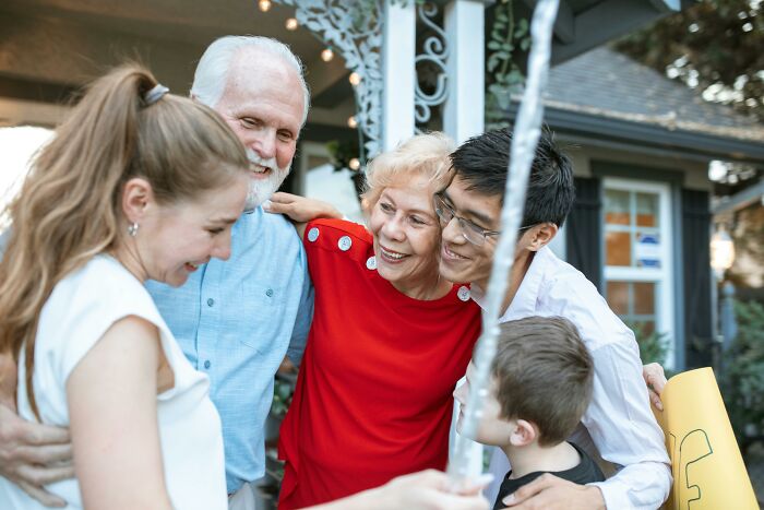 Family gathering showing affection and joy, highlighting the respect within the parent-child relationship over decades.