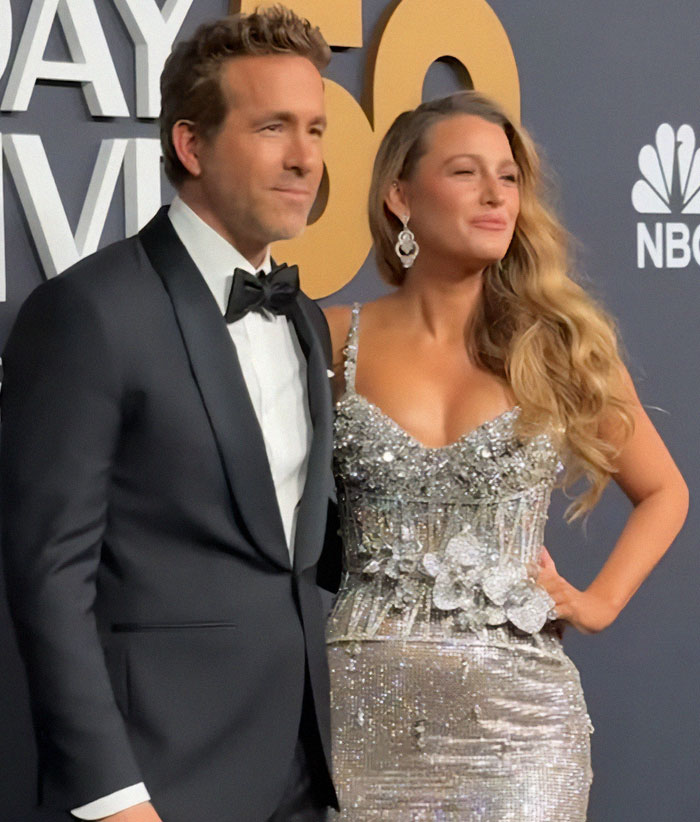Ryan Reynolds in a tuxedo at SNL 50 event, posing with a smile; SEO keyword: Kevin Costner Reaction. Ryan Reynolds in a tuxedo at SNL 50 event, posing with a smile; SEO keyword: Kevin Costner Reaction.