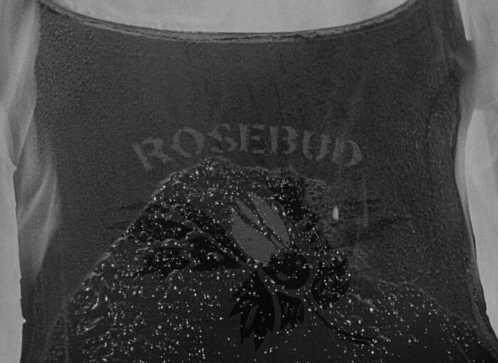 "Close-up of a snow globe with 'Rosebud,' a well-known famous movie prop."