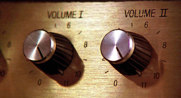 Amplifier knobs from a famous movie prop, labeled Volume I and Volume II, turned up high.