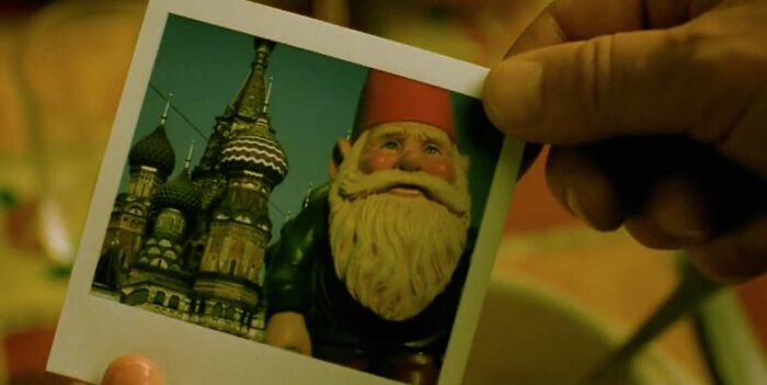 Polaroid of a garden gnome and Russian architecture, related to famous movie props stories.