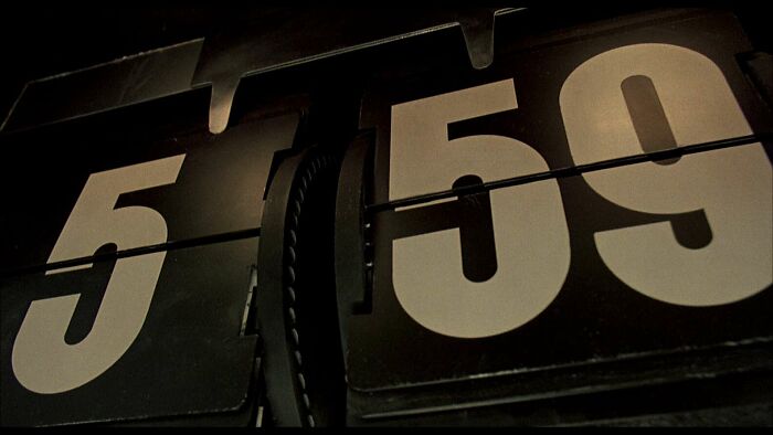 Flip clock displaying 5:59, related to famous movie props.