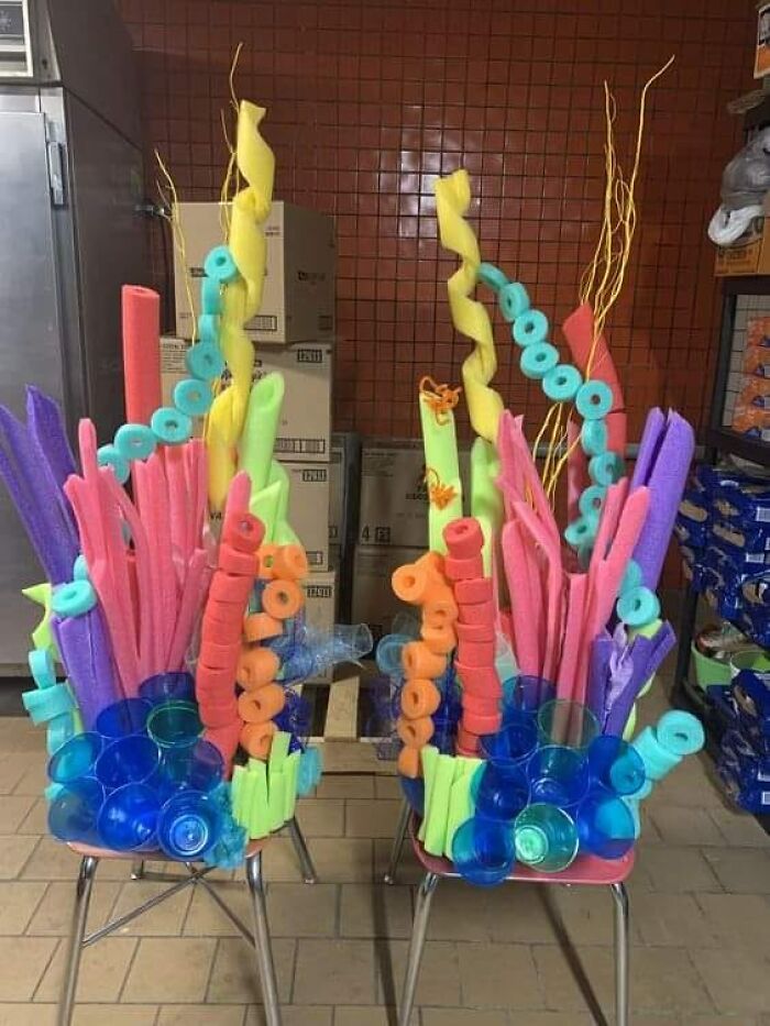 Colorful horrendous DIY project with pool noodles and plastic cups resembling coral on chairs, ready for craft shaming.