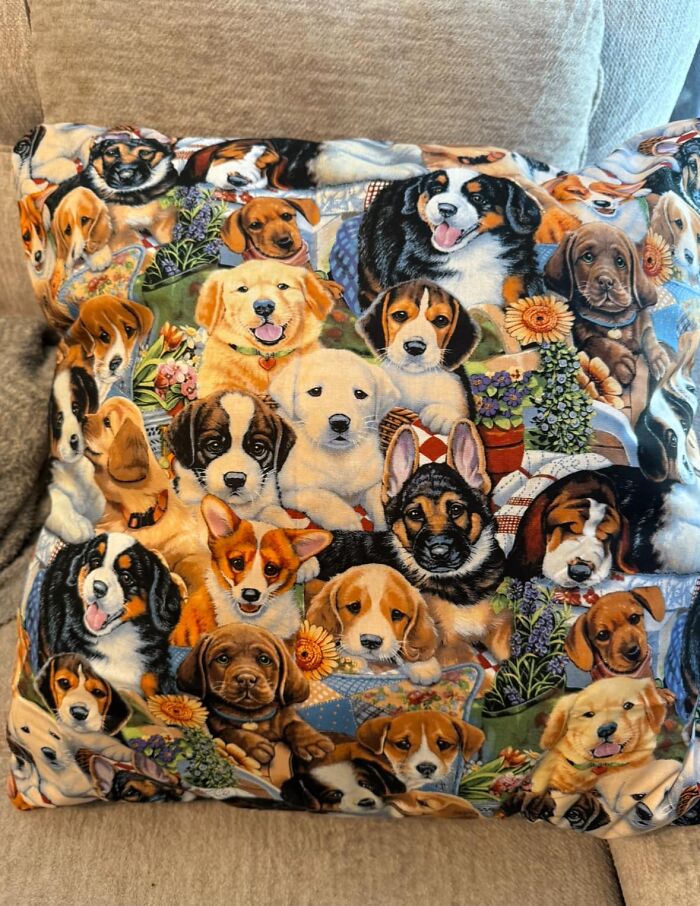 DIY pillow with a chaotic collage of dog images, showcasing horrendous craft e*******n needing shaming.
