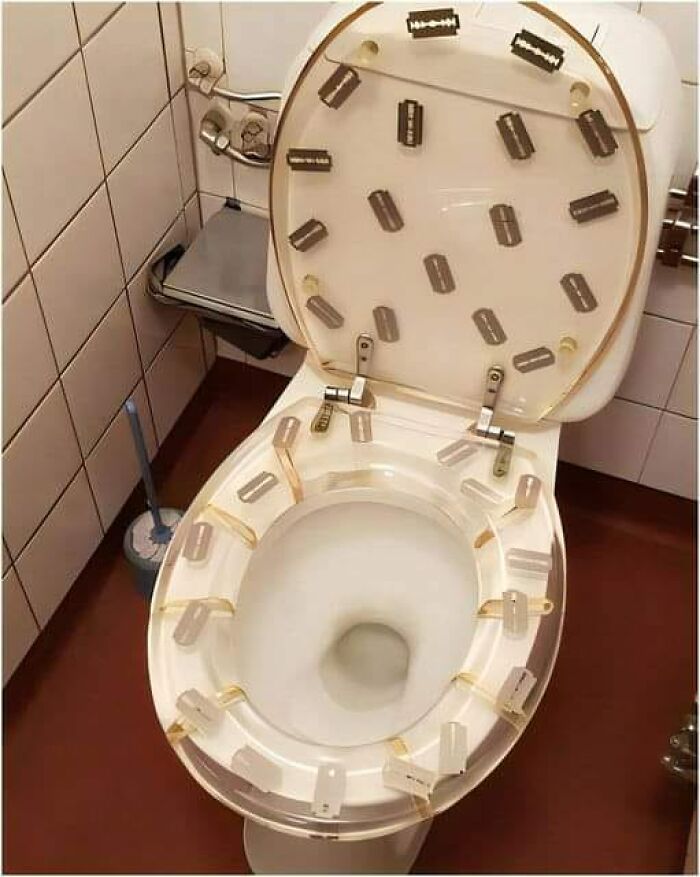 Toilet seat covered with razor blades, an example of horrendous DIY projects for craft shaming.