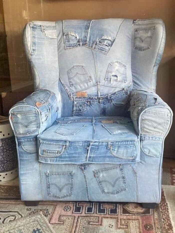 Denim armchair covered with multiple jean pockets, an example of a DIY project that might deserve craft shaming.