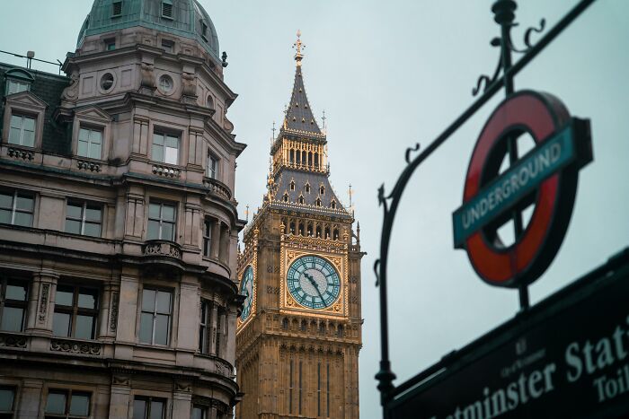 Big Ben and Westminster Station underground sign in London.