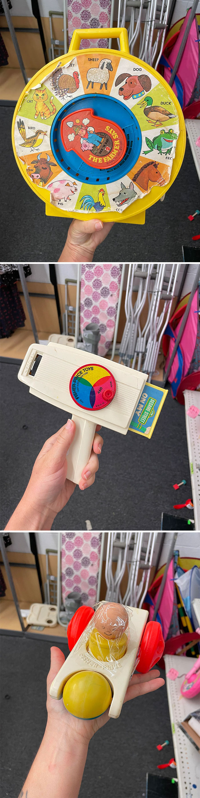 Vintage toys including a See 'n Say, a Fisher Price movie viewer, and a Fisher Price car with a plastic figure inside.