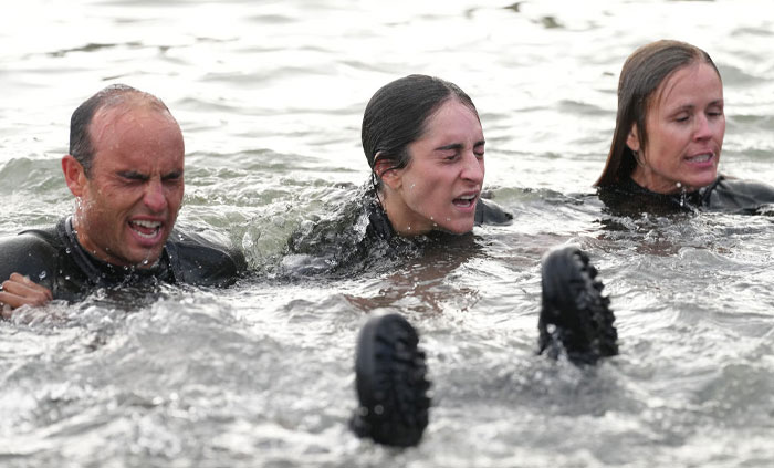 Participants of Special Forces Season 3 including Landon Donovan enduring a water challenge, showcasing their survival skills.