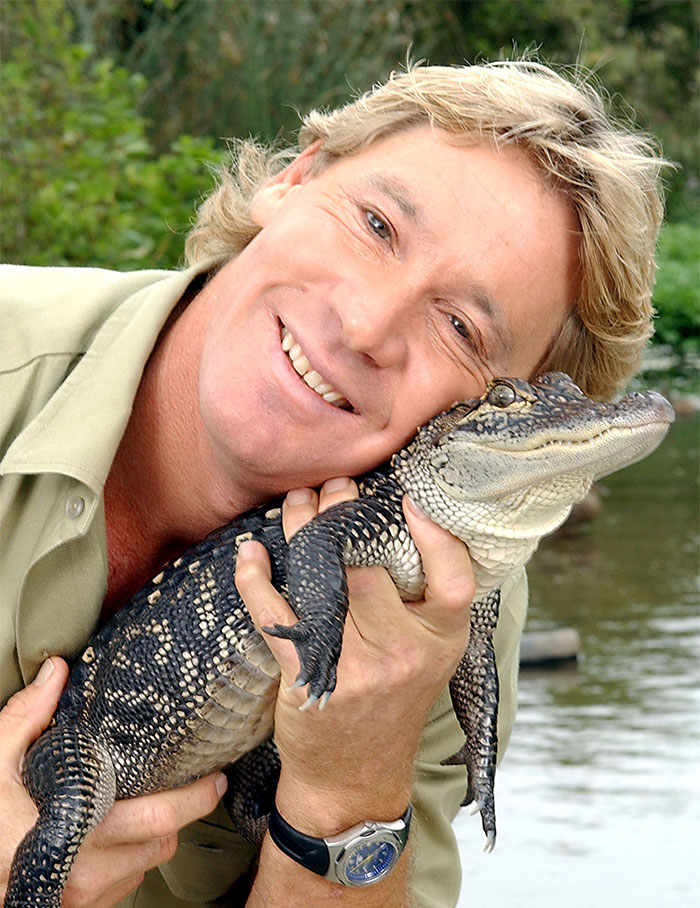 Celebrity holding a small crocodile, smiling outdoors, tragically passed away and stunned the world.