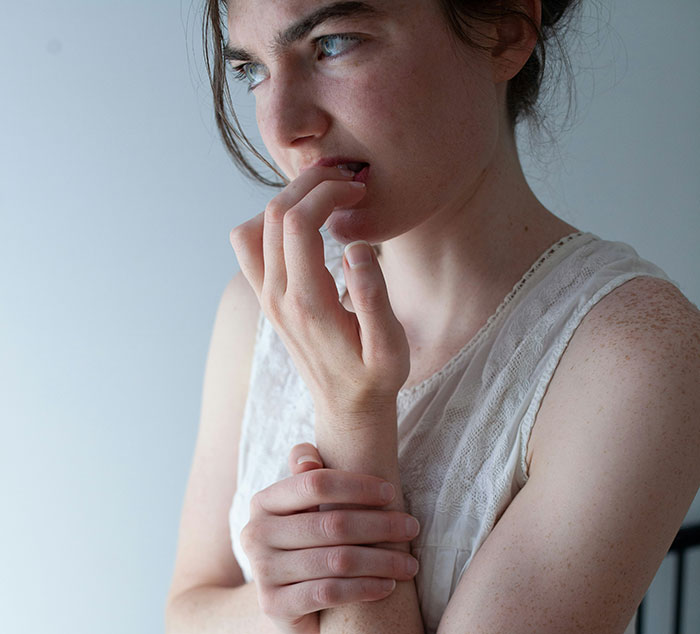 Teen looking contemplative, prioritizing her future over babysitting responsibilities.