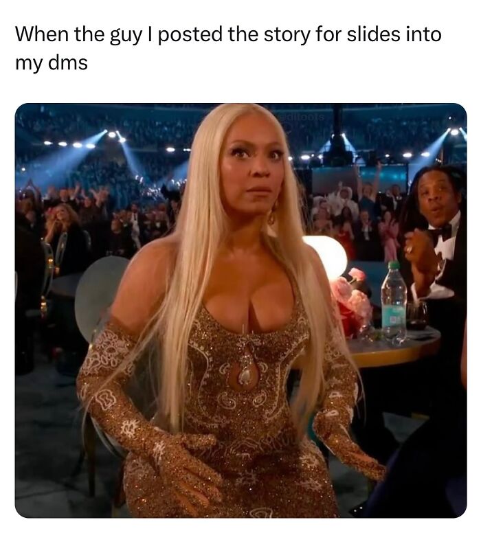 Woman in a glamorous dress, seated at an elegant event, reacting humorously; 2025 Grammys reactions.