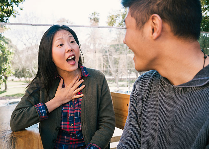 Man and woman having a heartfelt conversation on a sunny day, highlighting relationship insights.