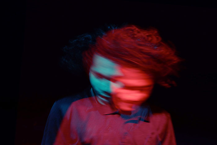 Blurred image of a person with red and blue lighting, symbolizing confusion and the fear of how to ruin your entire life.