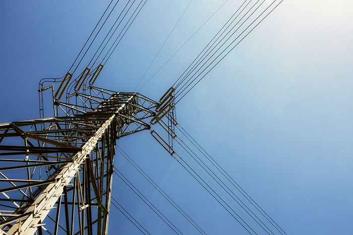 Power lines against a clear blue sky, representing a life-changing action.