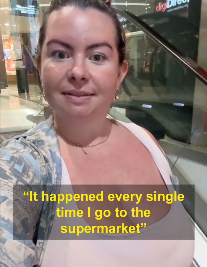 Woman with G-cup in a shopping center, addressing comments on her appearance.