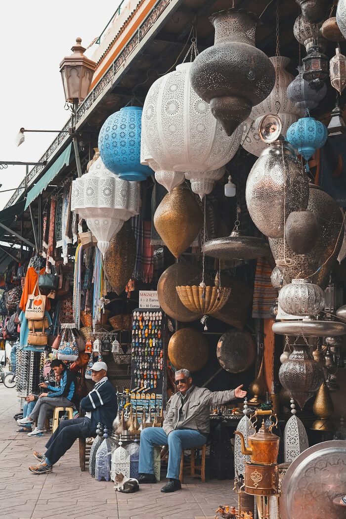 Market stall with ornate lanterns in a bustling street, capturing the essence of culture shocks abroad.