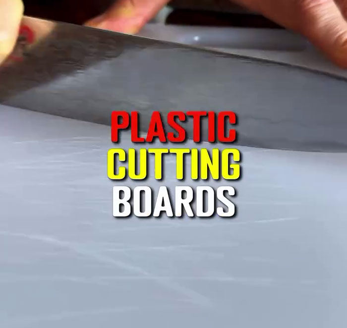 A knife on a plastic cutting board with text highlighting "Plastic Cutting Boards" as a toxic kitchen item. A knife on a plastic cutting board with text highlighting "Plastic Cutting Boards" as a toxic kitchen item.