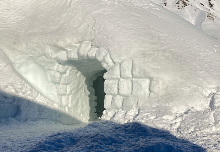 Snow igloo structure highlighting wild questions about people's homeland.