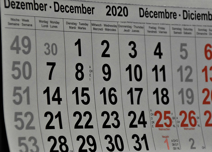 December 2020 multilingual calendar page showing dates and weekdays.