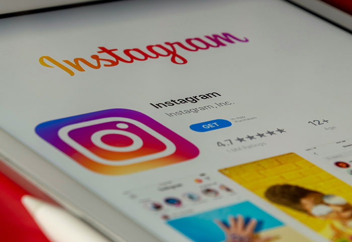 Instagram app displayed on a tablet screen, showing download and user rating options.