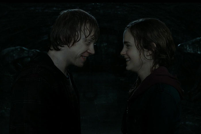 Two TV characters stand facing each other, illustrating a TV couple with questionable chemistry.