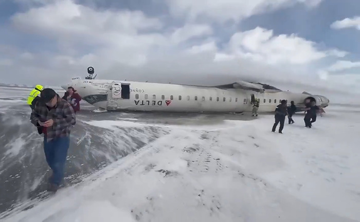 Overturned Delta plane on snow-covered ground.