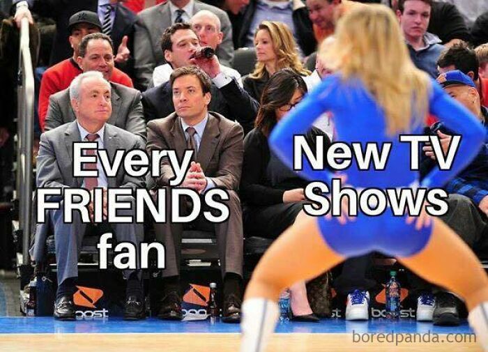 Two men labeled as "Every FRIENDS fan" sitting uninterested, with a cheerleader labeled "New TV Shows" performing in front. Funniest memes.