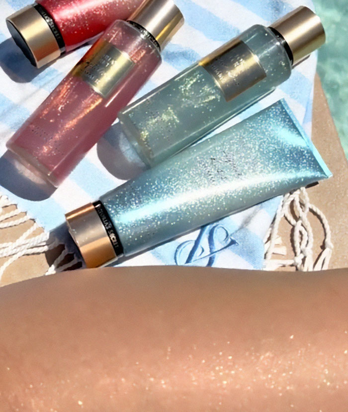 Glitter bottles on a striped towel, showcasing single women's creative protection strategy for dates. Glitter bottles on a striped towel, showcasing single women's creative protection strategy for dates.