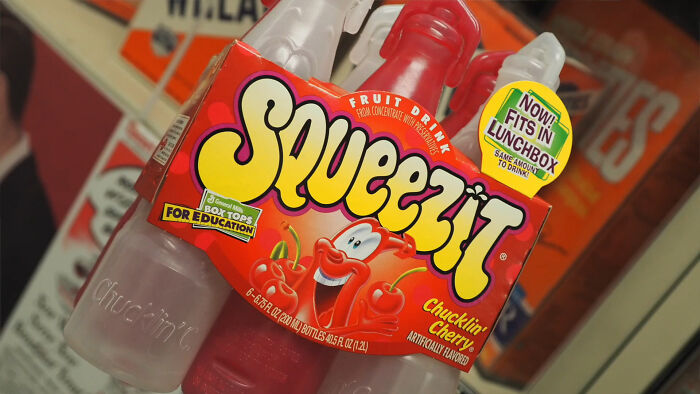 Squeezit fruit drink bottles showcasing nostalgic 90s and 2000s food items.