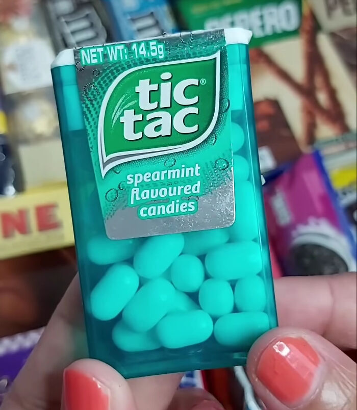 Tic Tac spearmint flavoured candies packaging held in hand, evoking nostalgia for food items from the 90s and 2000s.