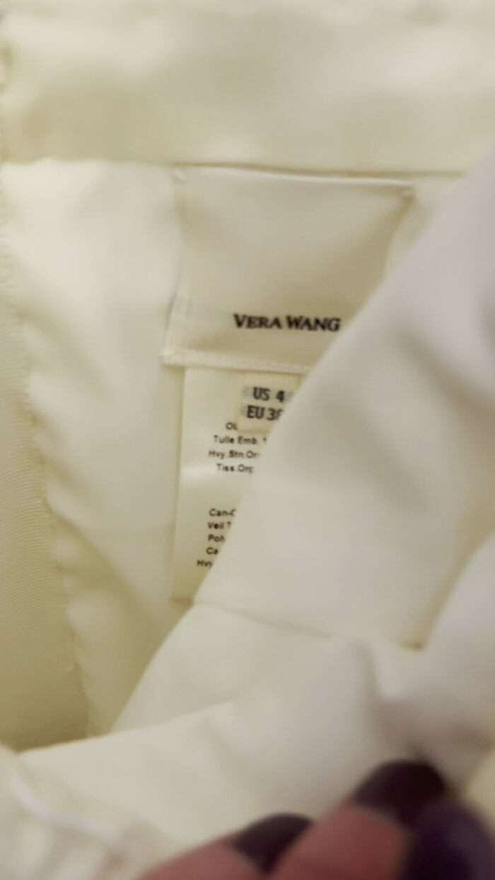 Close-up of a Vera Wang label inside a wedding dress, found by a thrift store shopper.