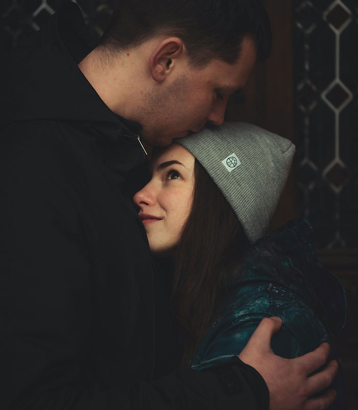 A man and woman embracing, with a focus on tender affection, suggesting men appreciate pretty things too.