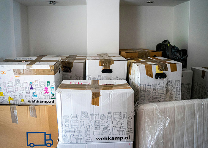 Boxes stacked in an empty room, representing a workplace where the entire staff quit unexpectedly.
