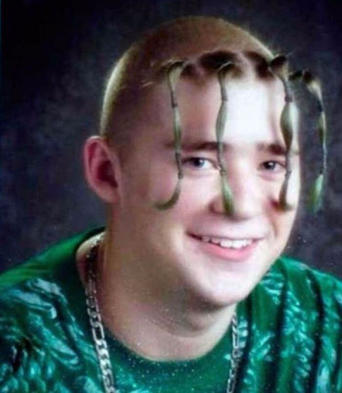 Person with unique 1990s hairstyle featuring twisted hair tendrils, smiling in a vibrant green outfit.