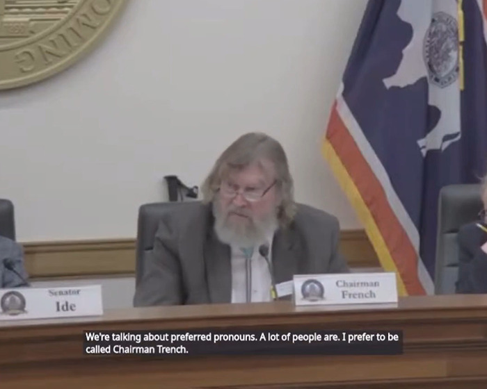 Sen. Tim French seated at meeting with a state flag in the background. Sen. Tim French seated at meeting with a state flag in the background.