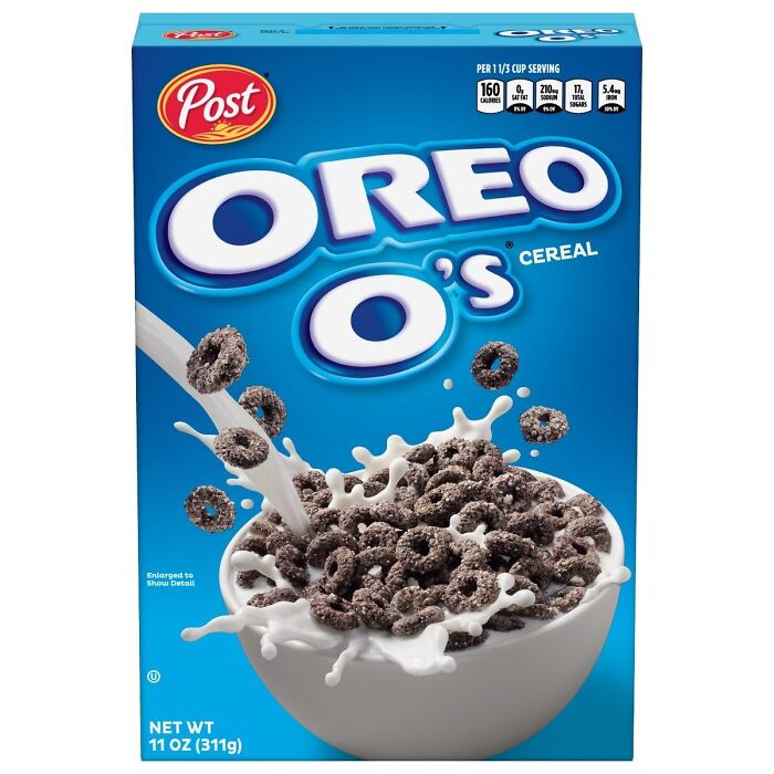 Oreo O's cereal box with nostalgic design, featuring chocolate rings and milk splash.