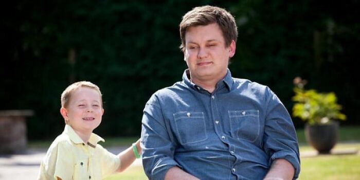 A wheelchair-using man with a smiling boy; an inspiring story of selfless donation for stem cell surgery.