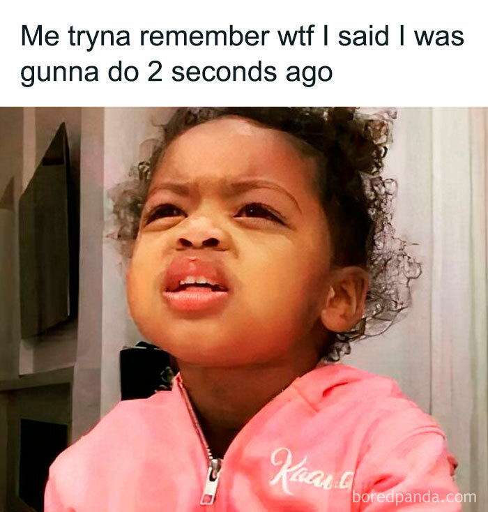 Confused toddler meme looking perplexed, wearing a pink jacket.