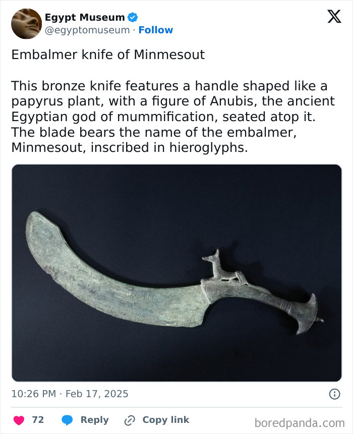 Bronze knife with Anubis figure, an ancient Egyptian artifact with hieroglyphs on the blade, showcasing Egyptian craftsmanship.