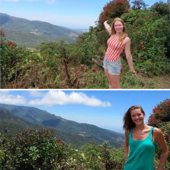 Two women posing on a scenic mountain trail with lush greenery and a distant view of the valley, under clear blue skies.
