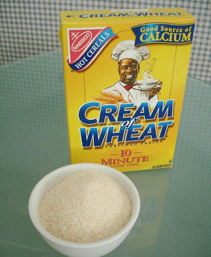Box of Cream of Wheat cereal and a bowl of the uncooked product, showcasing a nostalgic breakfast choice.